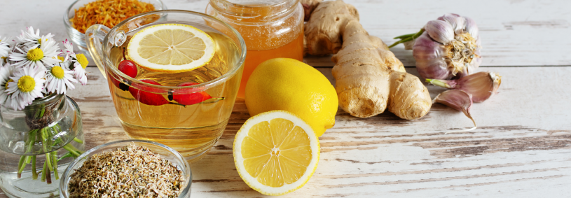 Cup of tea with chamomile, lemon, ginger and honey