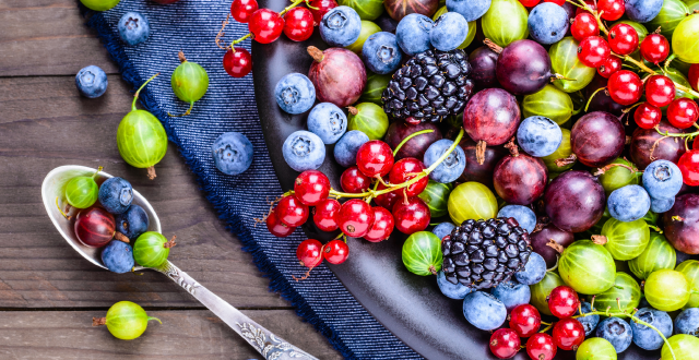 A plate of bright and colourful berries viewed from the top